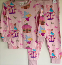 Children's pink pajama set with fairy design on a white background